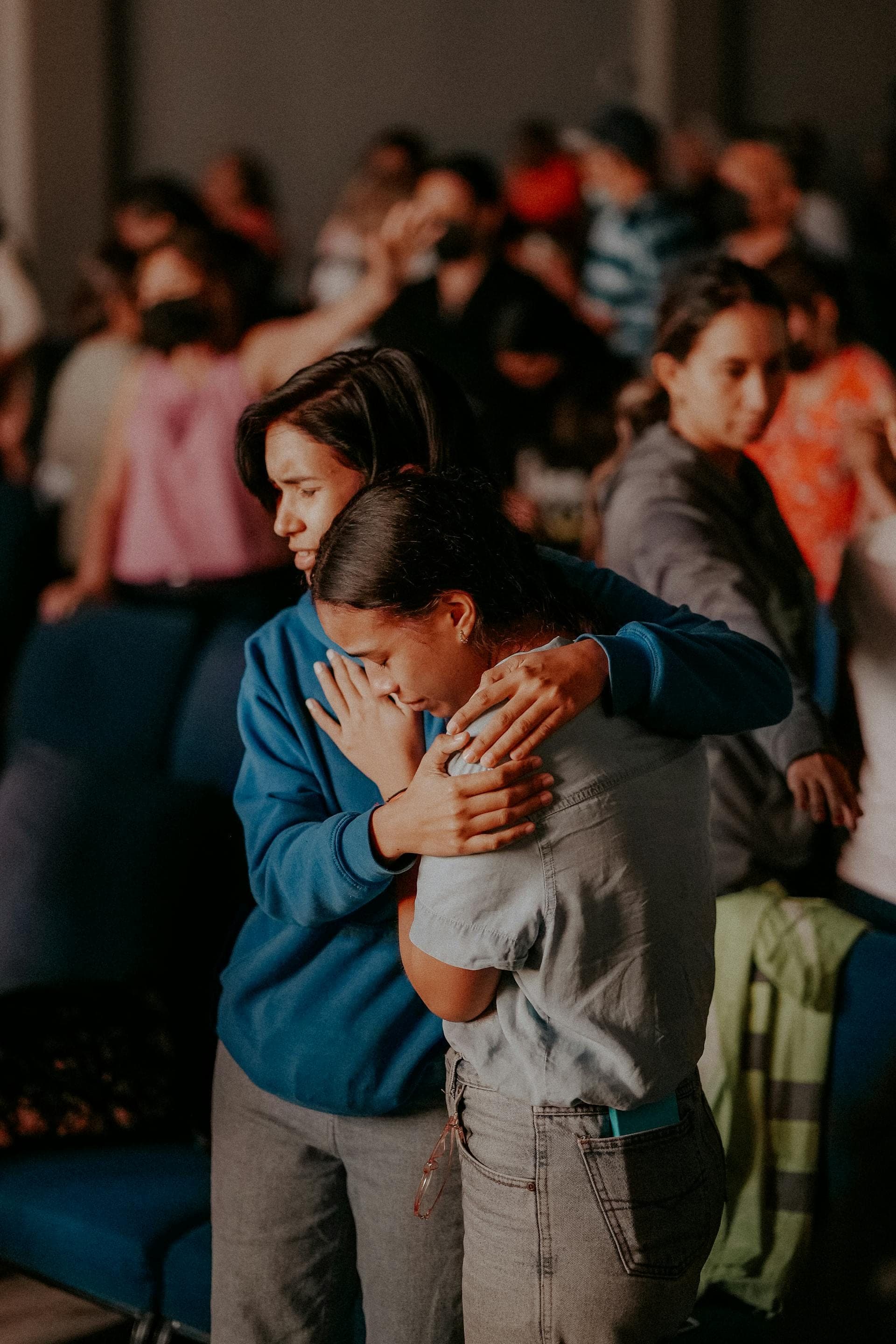 Two people sitting together in quiet prayer